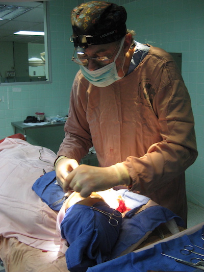 Dr. Chatham performing surgery on a mission in Ecuador